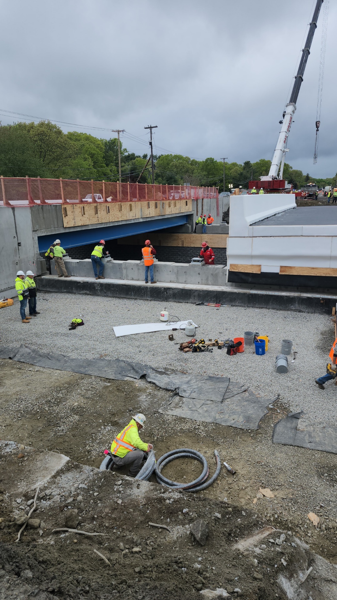 Bridge construction with precast concrete elements